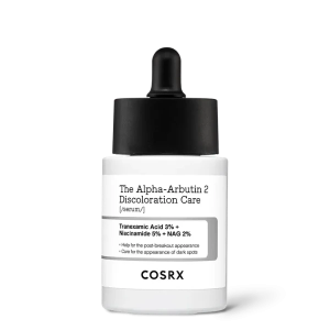 Close-up of the COSRX Alpha-Arbutin 2 Discoloration Care Serum bottle, showing Tranexamic Acid 3%, Niacinamide 5%, and NAG 2% on the label for treating dark spots and uneven skin tone