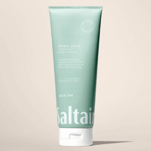 Saltair Retinol Revive Overnight Body Lotion 10 oz tube on a beige background.