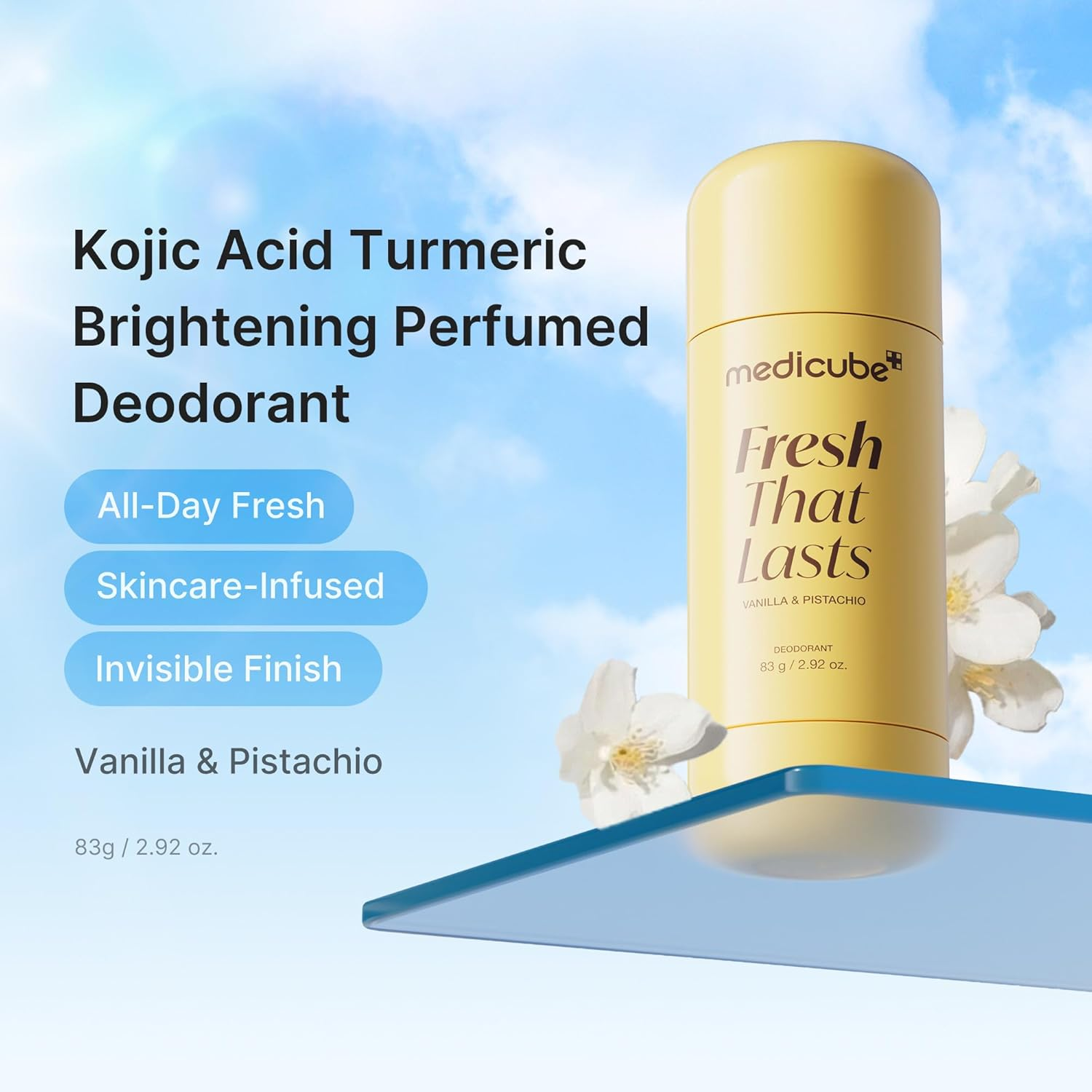 Medicube Kojic Acid Turmeric Aluminum Free Deodorant stick on blue platform with jasmine flowers