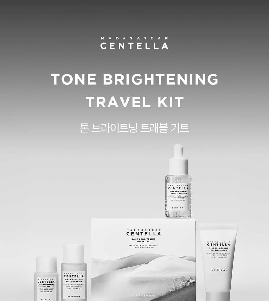SKIN1004 Madagascar Centella Tone Brightening Travel Kit with cleansing foam, toner, ampoule and cream on grey background